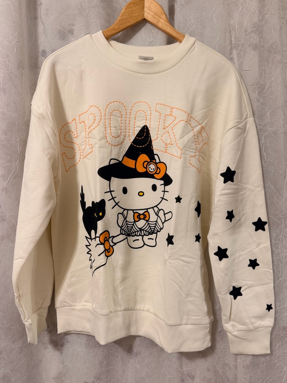 Hello Kitty Cream Halloween 'Spooky' Sweatshirt with Black Stars